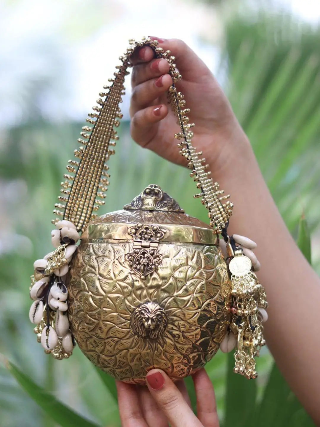 Ishhaara Handcrafted Oval Shaped Banjara Metal Clutch