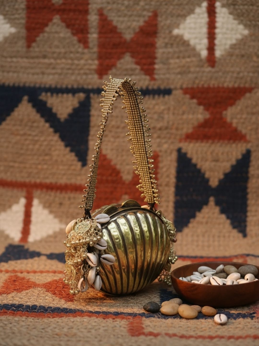 Ishhaara Handcrafted Shell Shaped Banjara Metal Clutch