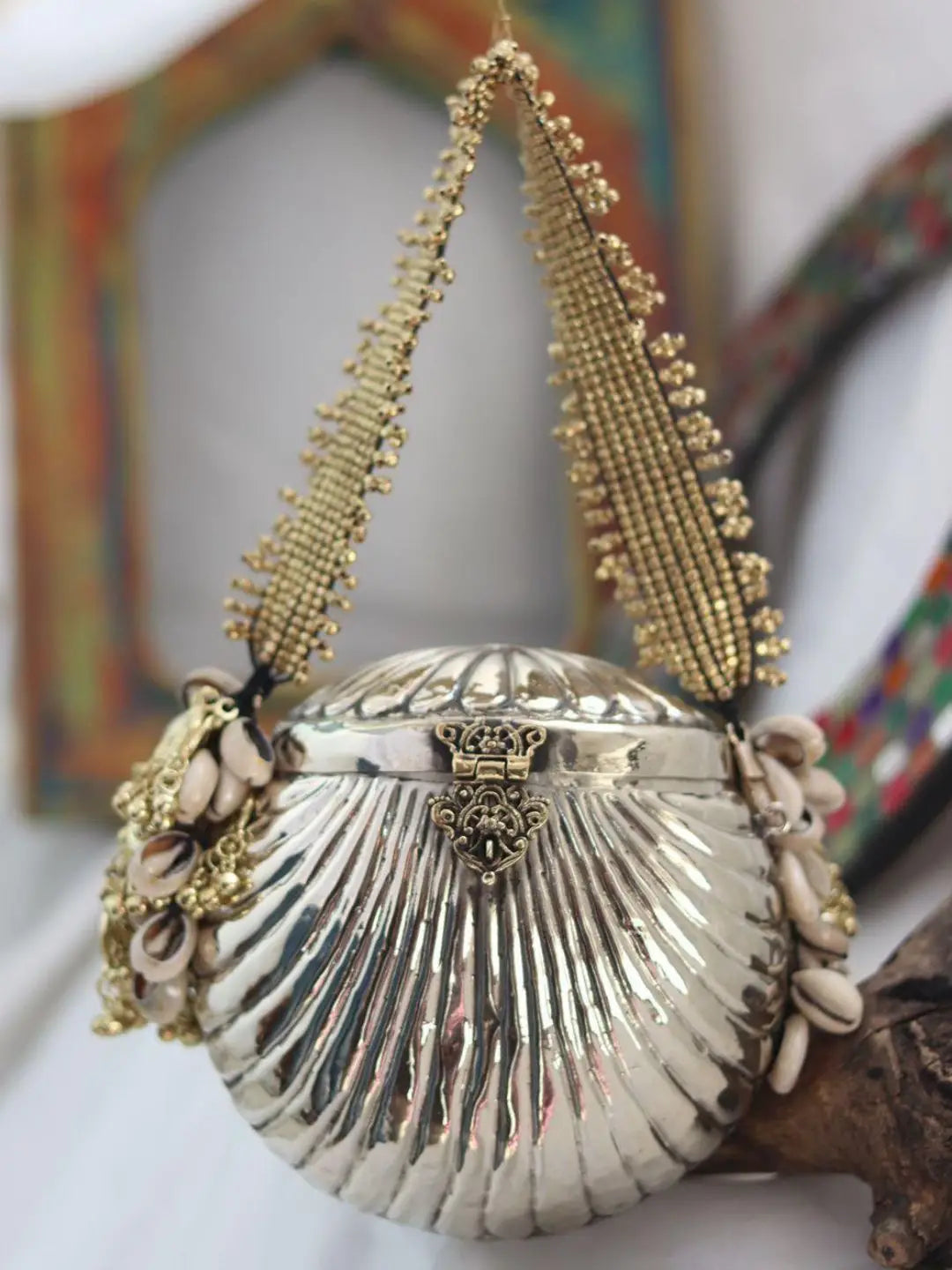 Ishhaara Oval Shaped Banjara Metal Clutch