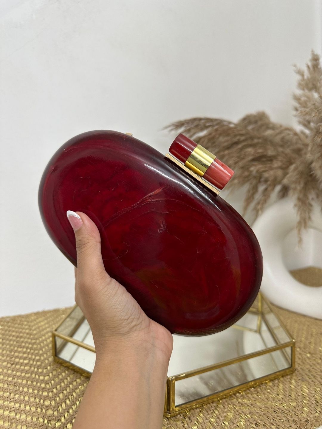 Ishhaara Red Capsule Resin Clutch Bag