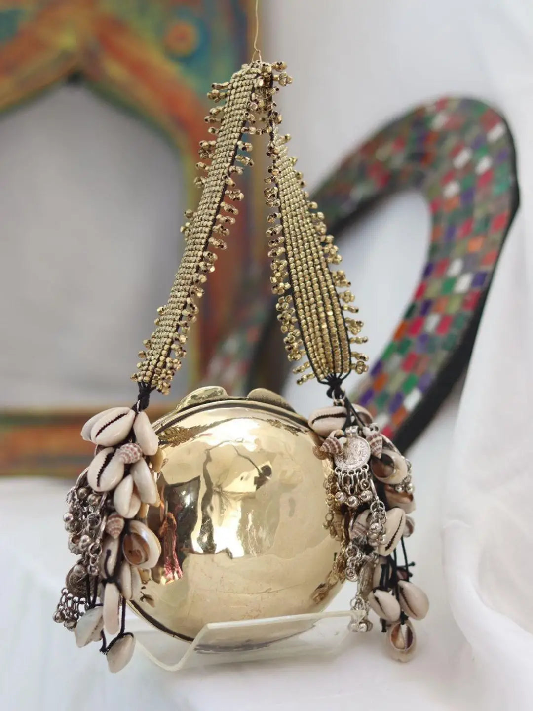 Ishhaara Round Banjara Metal Clutch