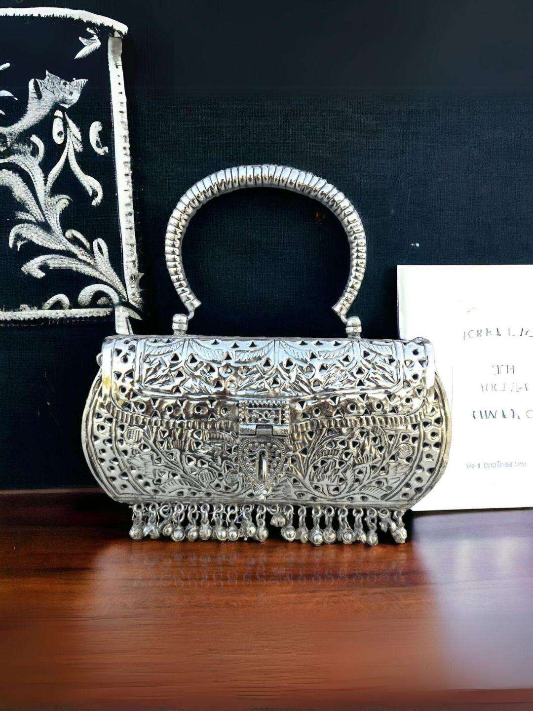 Ishhaara  Hand Carved High Quality German Silver Clutch