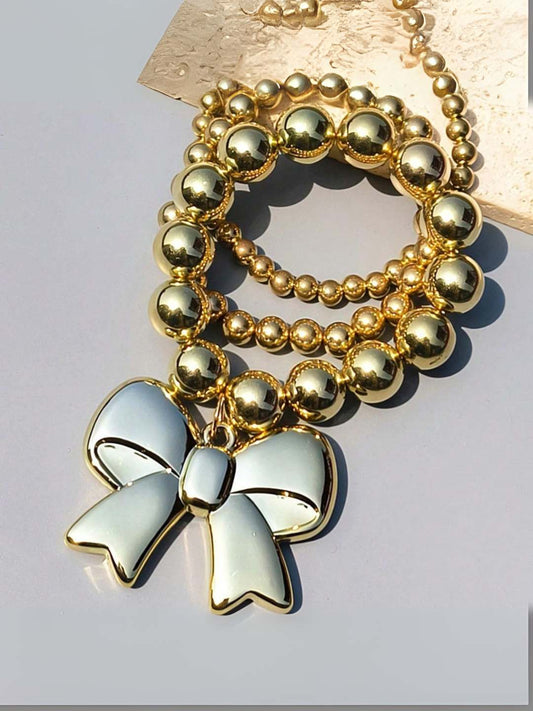 Ishhaara Bow Shaped Charm Studded Golden Whimsy Bracelet