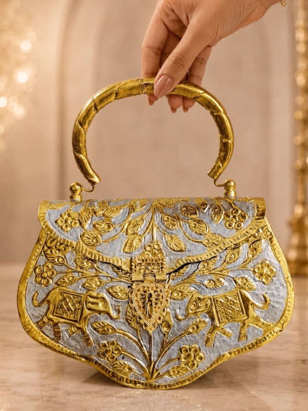 Ishhaara Elephant And Floral Engraved Clutch