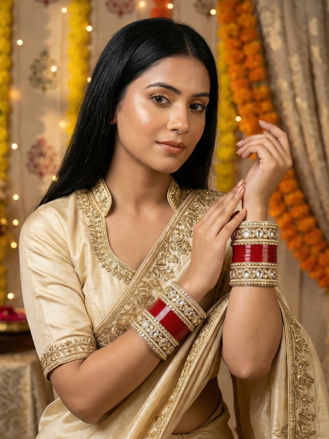 Ishhaara Embellished Kundan Bangle Set Red - A woman wearing a traditional Indian outfit with red and gold bangles