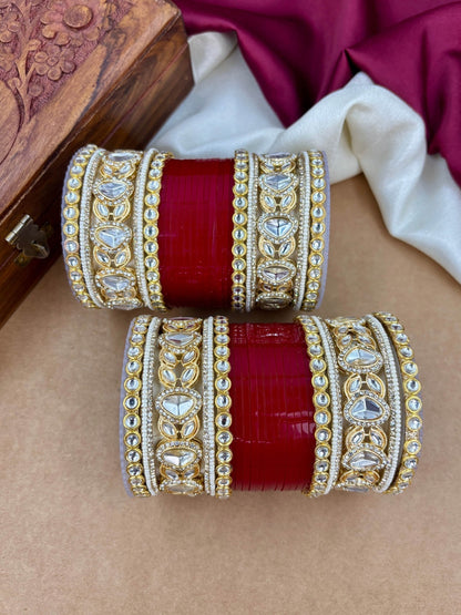 Ishhaara Embellished Kundan Bangle Set Red - A woman wearing a traditional Indian outfit with red and gold bangles - view 3