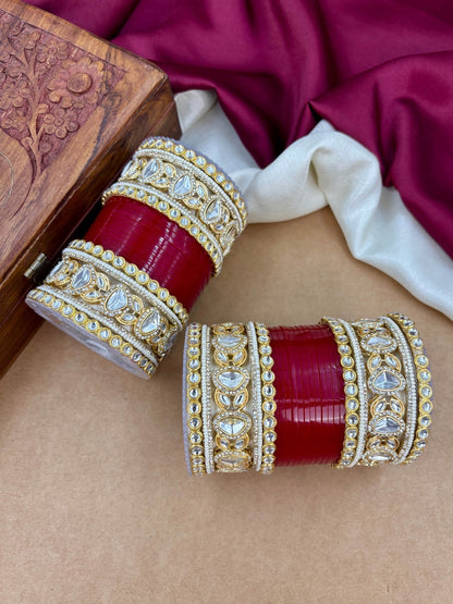 Ishhaara Embellished Kundan Bangle Set Red - A woman wearing a traditional Indian outfit with red and gold bangles - view 4