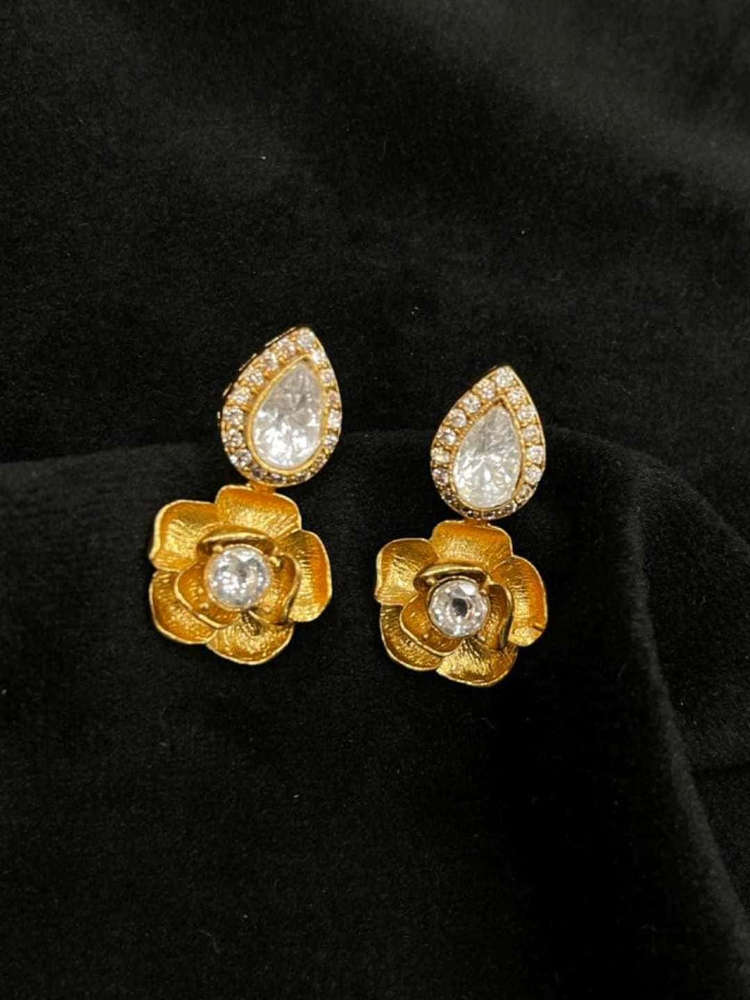 Ishhaara Floral Matte Gold White Ad Stone Stud Earring
