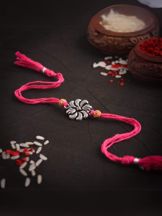 Ishhaara Flower Shaped German Silver Rakhi