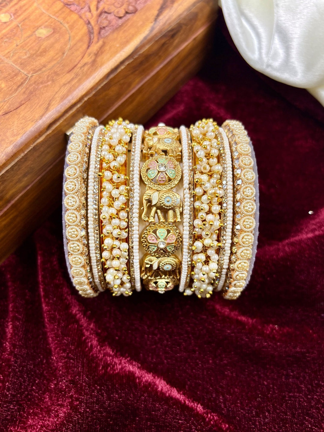 Ishhaara Gold Elephant Bangle Set - a stunning piece of jewelry featuring elephant motifs and intricate designs