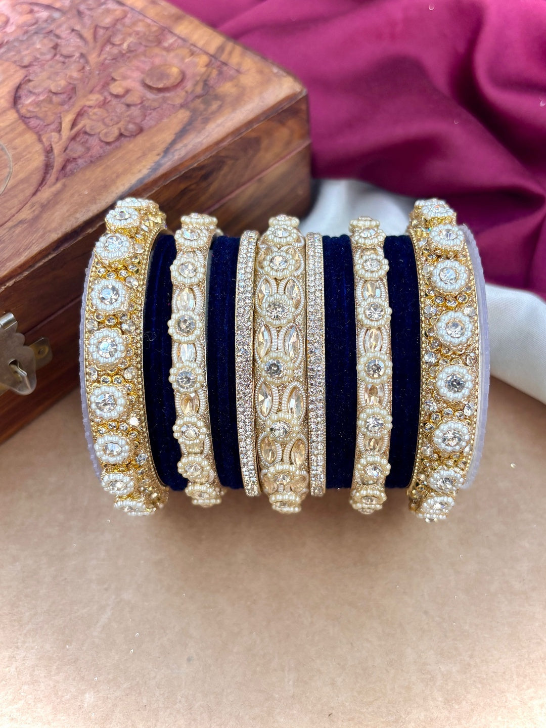 Ishhaara Gold Plated Kundan Bangle Set - A set of gold plated kundan bangles with intricate designs and velvet inner lining