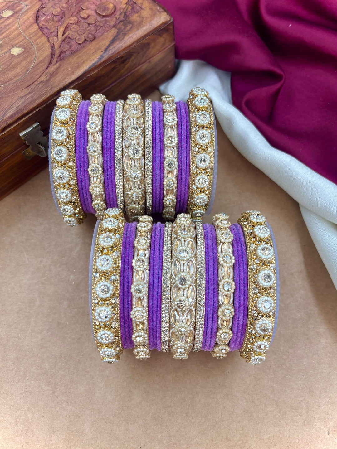 Ishhaara Gold Plated Kundan Bangle Set - A set of gold plated kundan bangles with intricate designs and velvet inner lining - view 8