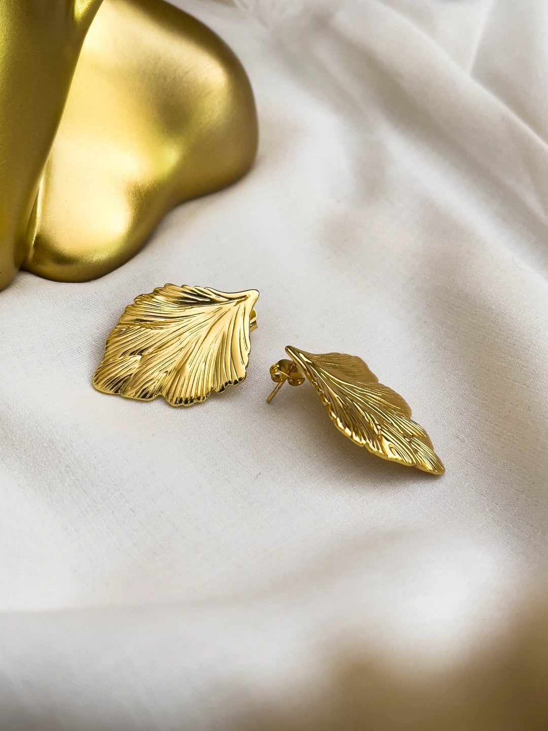 Ishhaara Golden Sculpted Leaf Stud Earrings