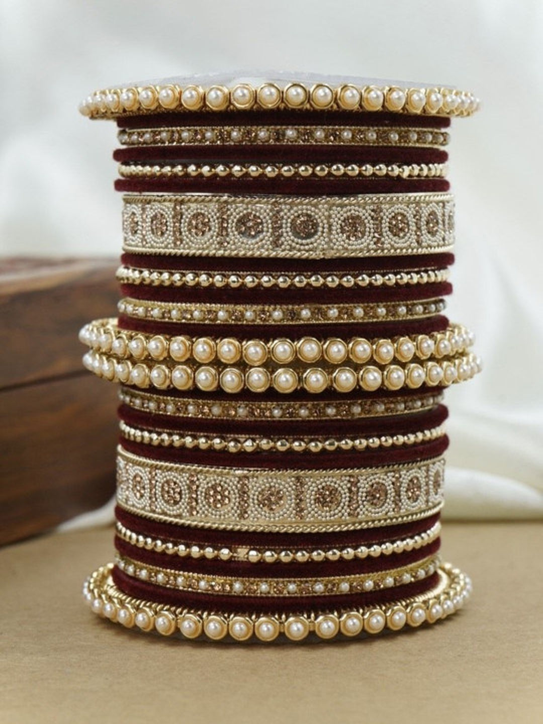 Ishhaara Green and Gold Embellished Bangle Set - a stack of green and gold bangles with pearl and velvet details - view 11