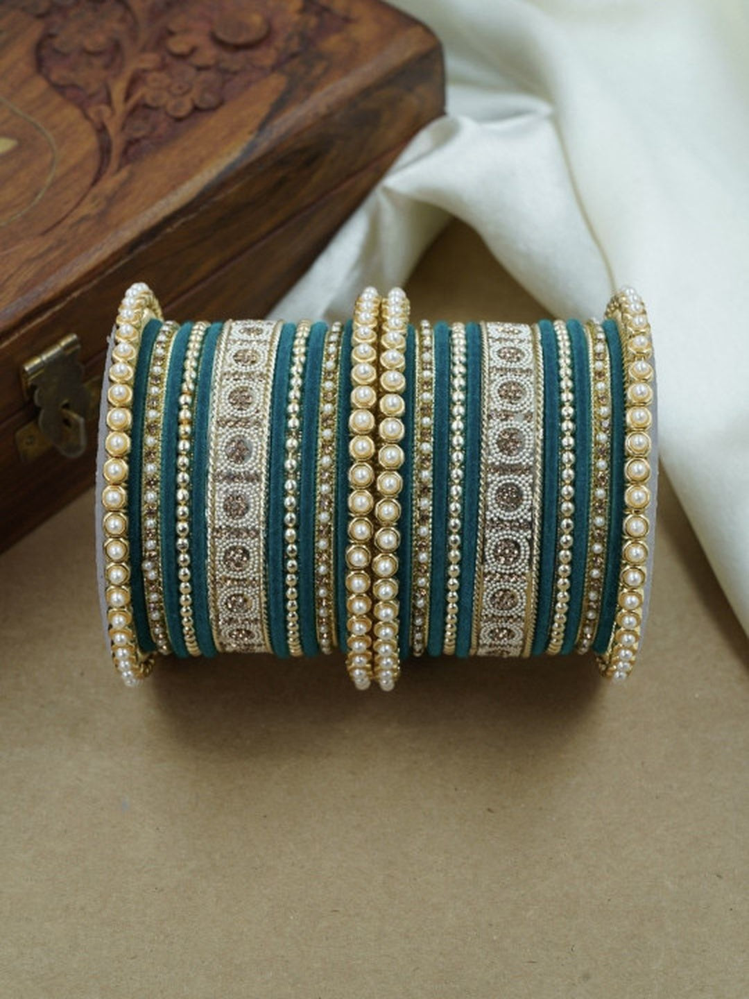 Ishhaara Green and Gold Embellished Bangle Set - a stack of green and gold bangles with pearl and velvet details - view 12