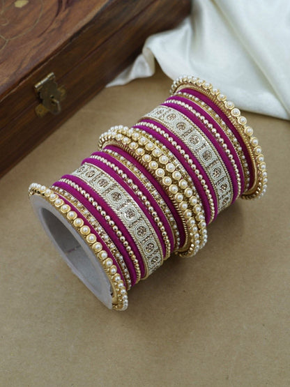 Ishhaara Green and Gold Embellished Bangle Set - a stack of green and gold bangles with pearl and velvet details - view 16