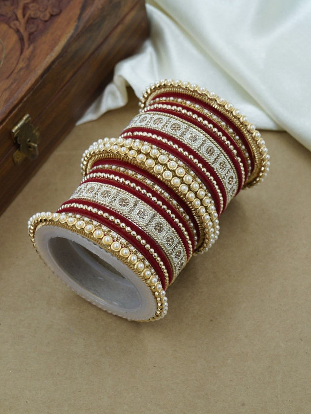 Ishhaara Green and Gold Embellished Bangle Set - a stack of green and gold bangles with pearl and velvet details - view 17