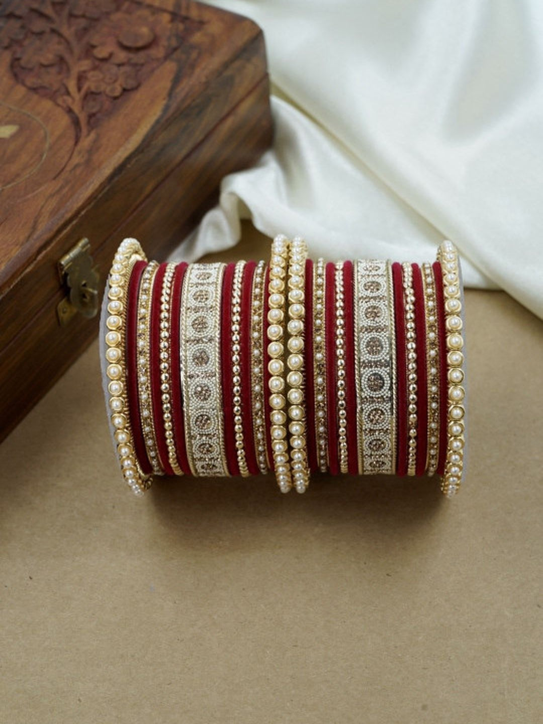 Ishhaara Green and Gold Embellished Bangle Set - a stack of green and gold bangles with pearl and velvet details - view 18