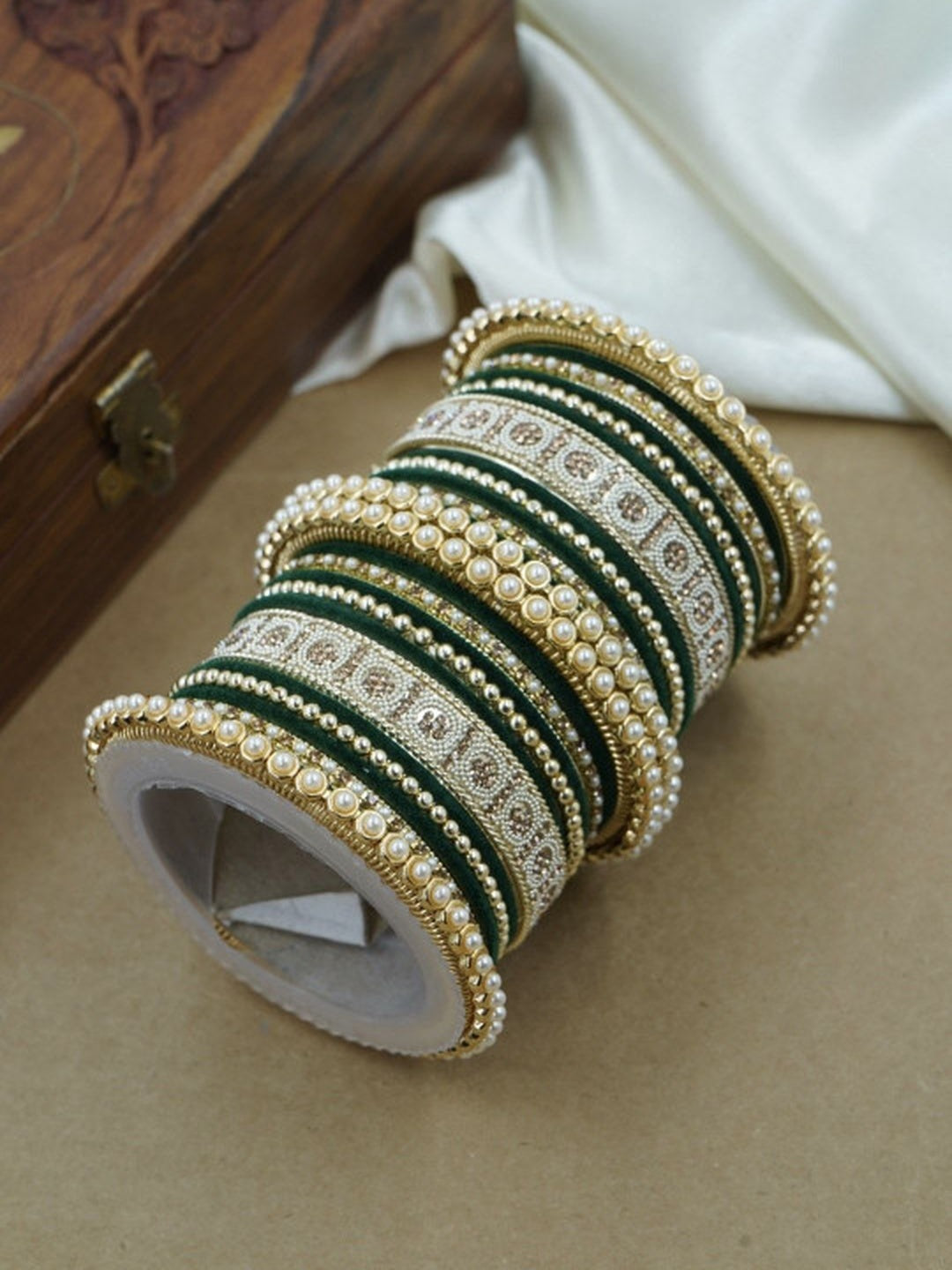 Ishhaara Green and Gold Embellished Bangle Set - a stack of green and gold bangles with pearl and velvet details - view 2