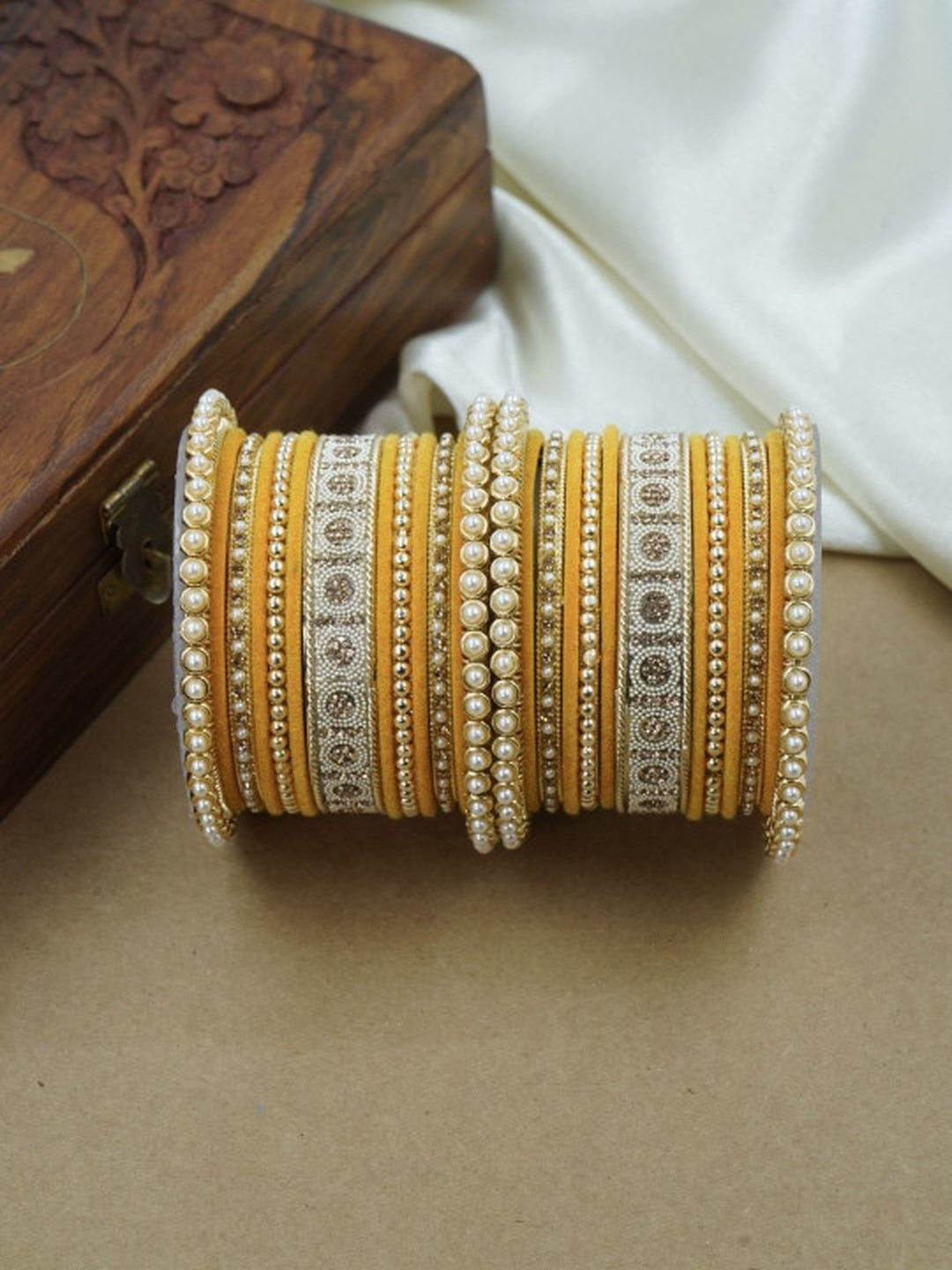 Ishhaara Green and Gold Embellished Bangle Set - a stack of green and gold bangles with pearl and velvet details - view 21
