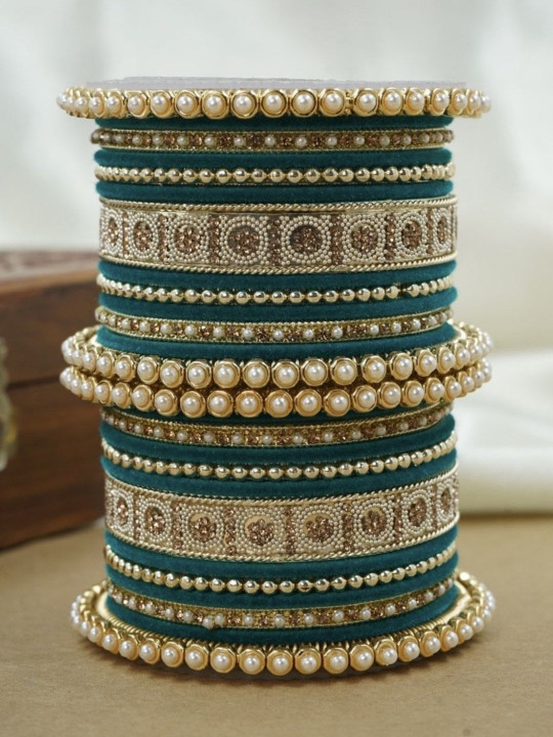 Ishhaara Green and Gold Embellished Bangle Set - a stack of green and gold bangles with pearl and velvet details - view 23