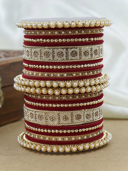 Ishhaara Green and Gold Embellished Bangle Set - a stack of green and gold bangles with pearl and velvet details - view 24
