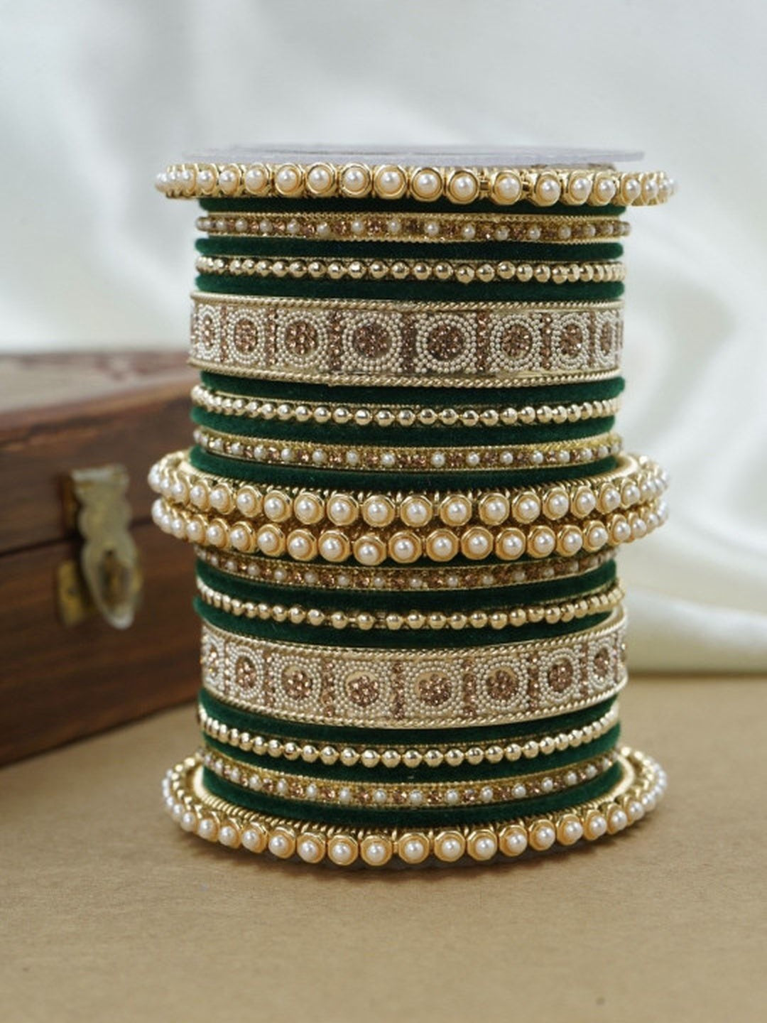 Ishhaara Green and Gold Embellished Bangle Set - a stack of green and gold bangles with pearl and velvet details - view 3