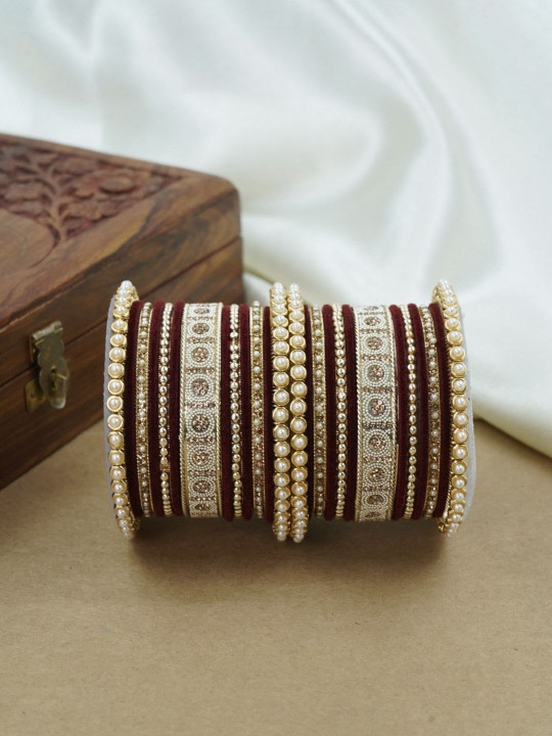 Ishhaara Green and Gold Embellished Bangle Set - a stack of green and gold bangles with pearl and velvet details - view 4