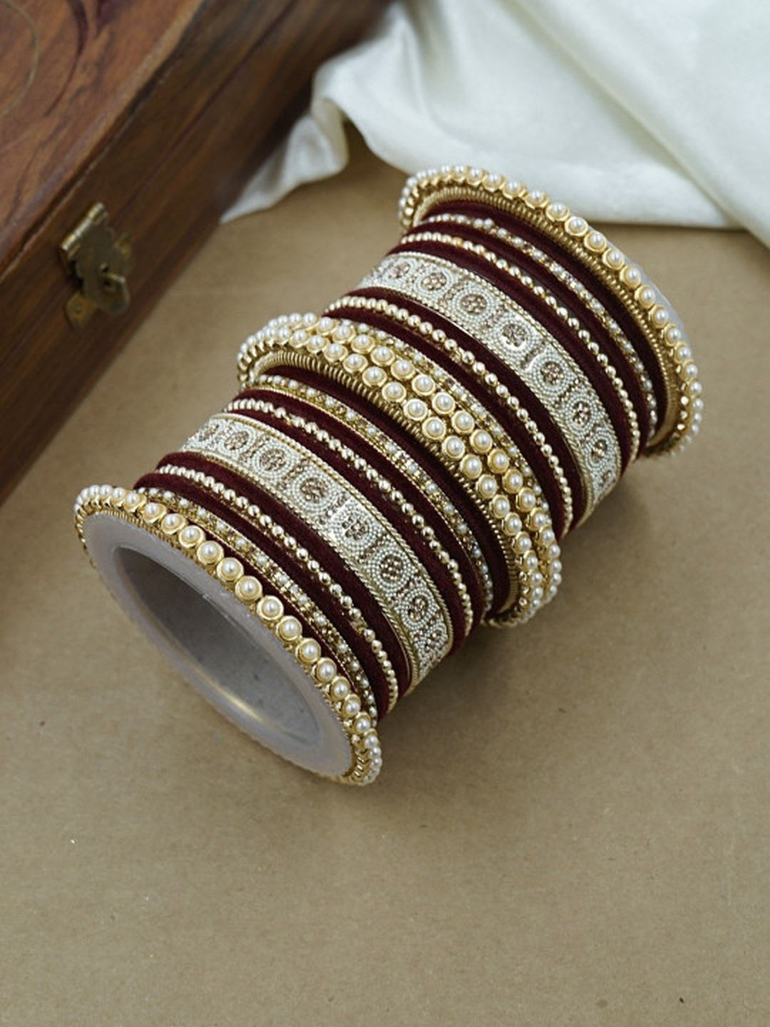 Ishhaara Green and Gold Embellished Bangle Set - a stack of green and gold bangles with pearl and velvet details - view 5