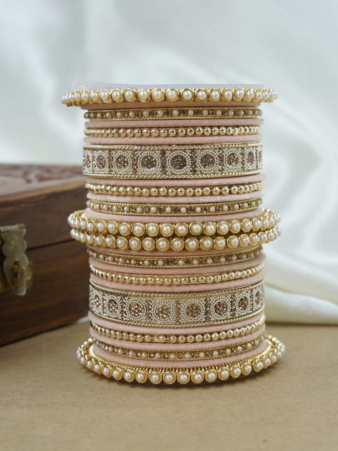 Ishhaara Green and Gold Embellished Bangle Set - a stack of green and gold bangles with pearl and velvet details - view 6
