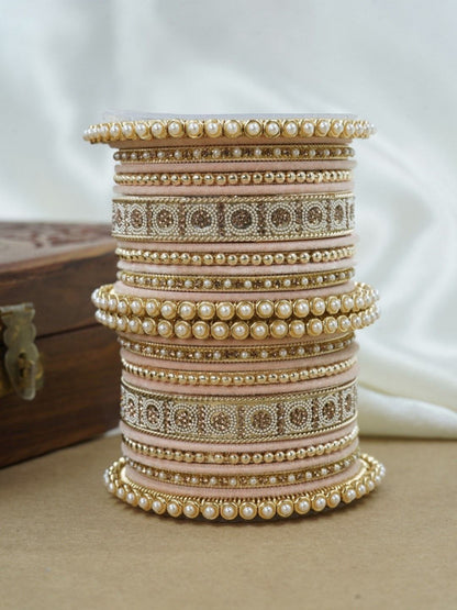 Ishhaara Green and Gold Embellished Bangle Set - a stack of green and gold bangles with pearl and velvet details - view 6