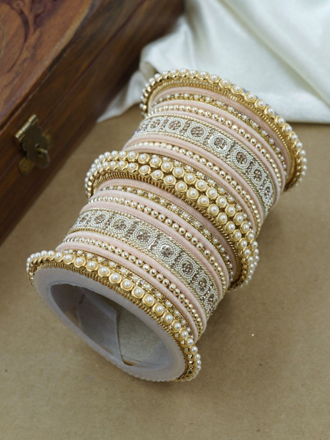 Ishhaara Green and Gold Embellished Bangle Set - a stack of green and gold bangles with pearl and velvet details - view 7