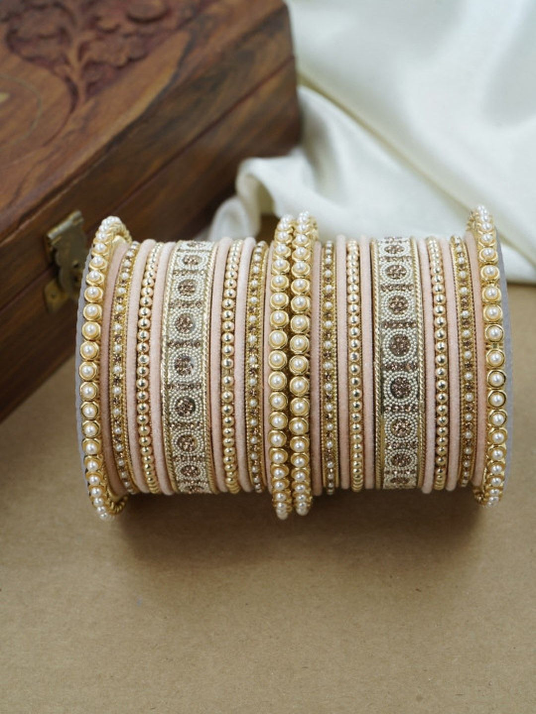 Ishhaara Green and Gold Embellished Bangle Set - a stack of green and gold bangles with pearl and velvet details - view 8