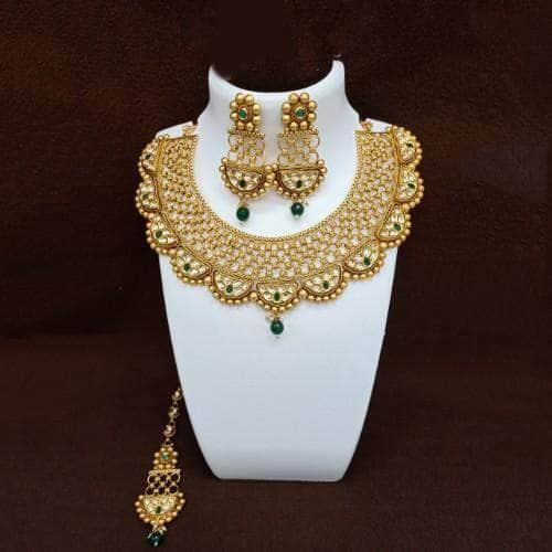Ishhaara Antique Gold Semi Circular Kundan Necklace Earring And Teeka Set