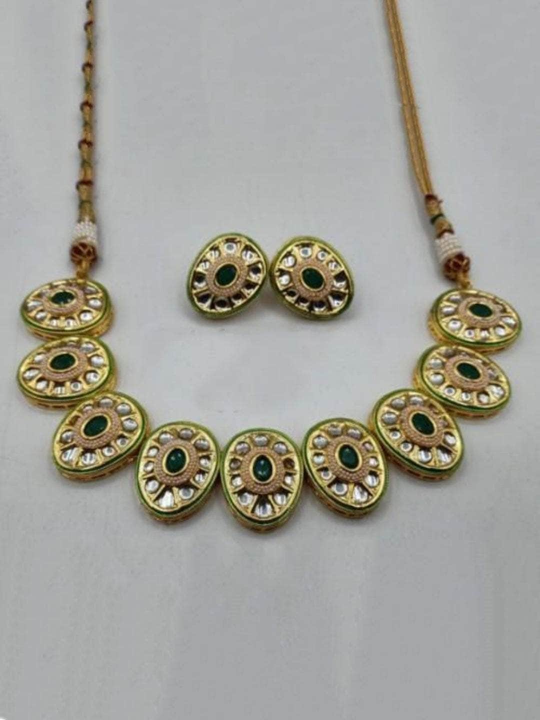 Ishhaara Green Oval Cut Kundan Necklace And Earring Set