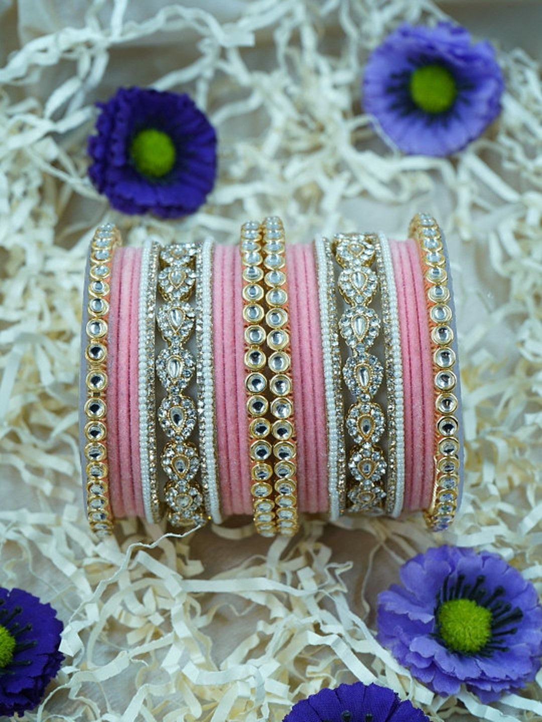 Ishhaara Green Velvet Kundan Bangles Set - a set of green and gold bangles with kundan stones on a wooden stand - view 8