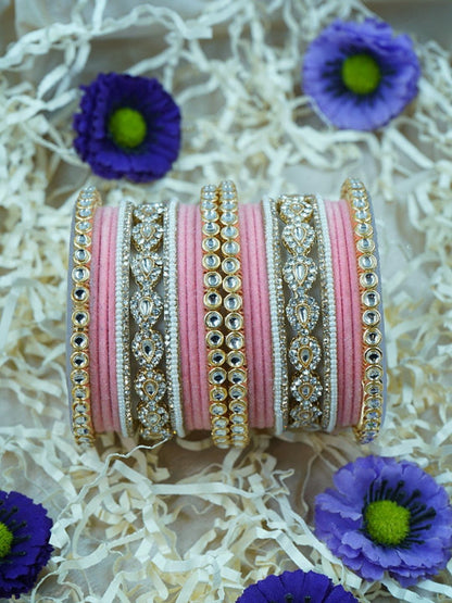 Ishhaara Green Velvet Kundan Bangles Set - a set of green and gold bangles with kundan stones on a wooden stand - view 8