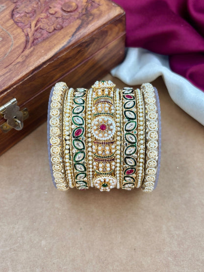 Ishhaara Handcrafted Kundan Bangles Set for Women - a woman wearing green saree with kundan bangles - view 2