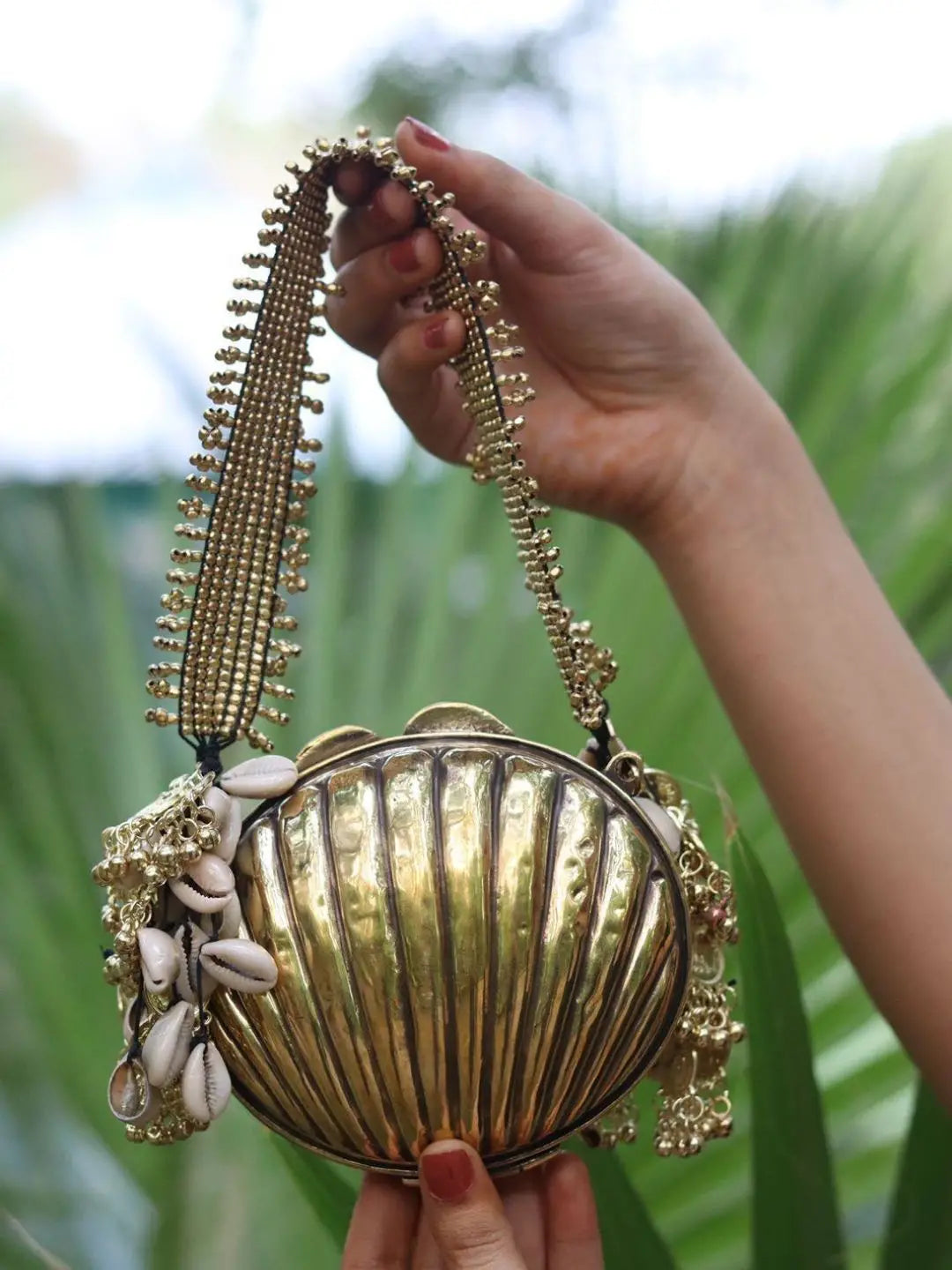 Ishhaara Handcrafted Shell Shaped Banjara Metal Clutch