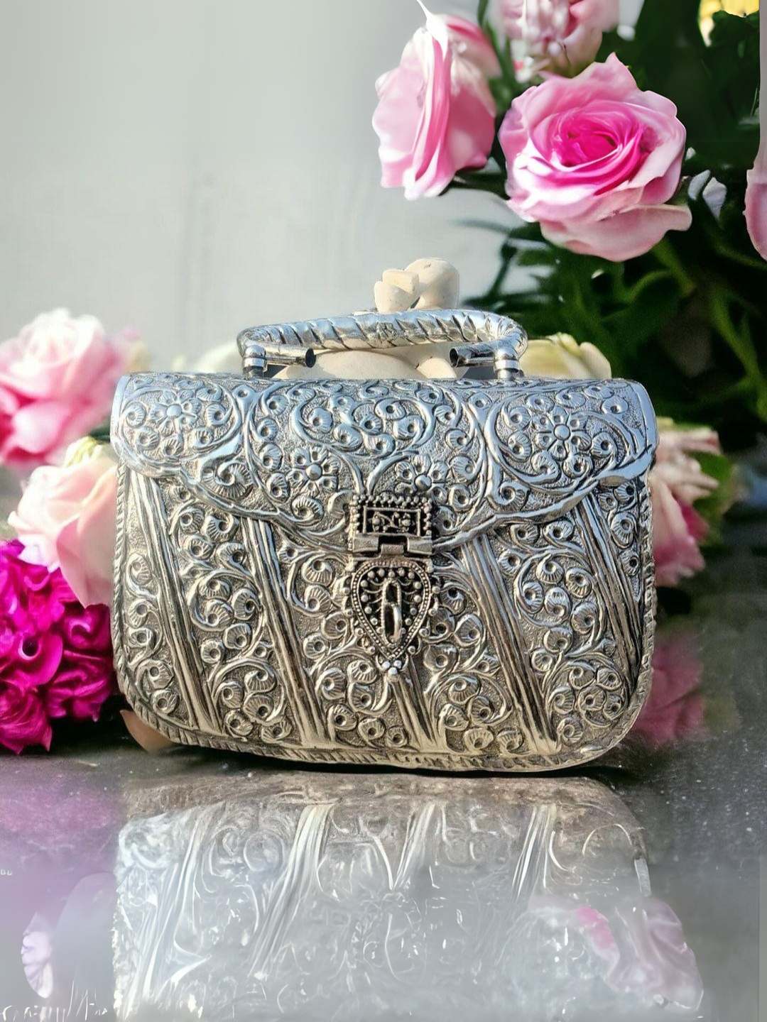 Ishhaara Handcrafted Stone Embedded Metal Clutch