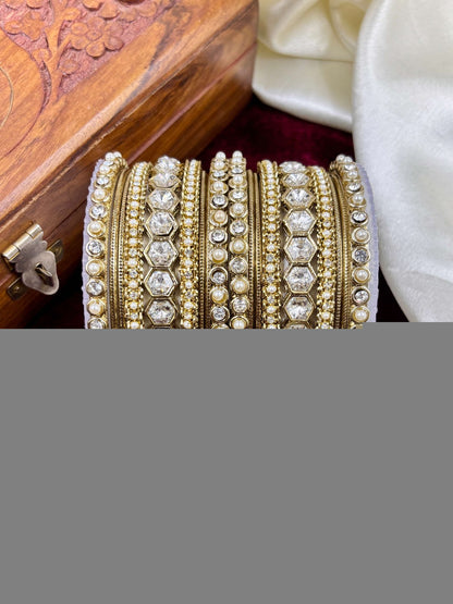 Ishhaara Kundan Bangle Set - a stack of intricately designed gold bangles with precious stones and pearls - view 2