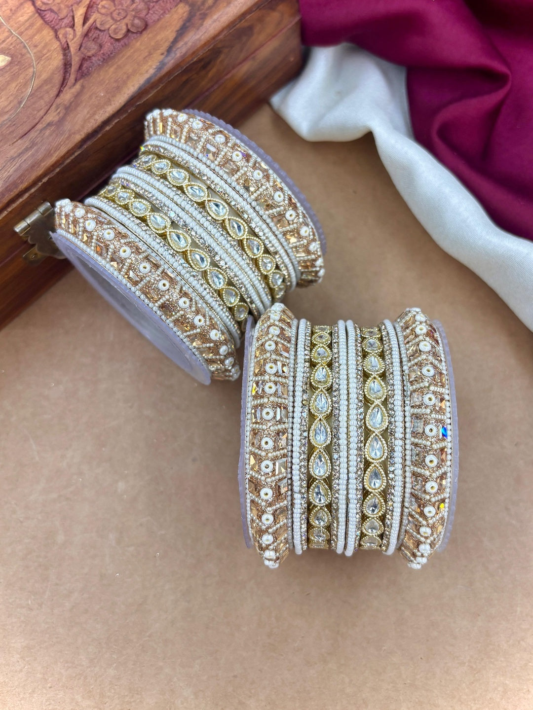 Ishhaara Kundan Bangle Set - A pair of intricately designed gold and white bangles with Kundan work