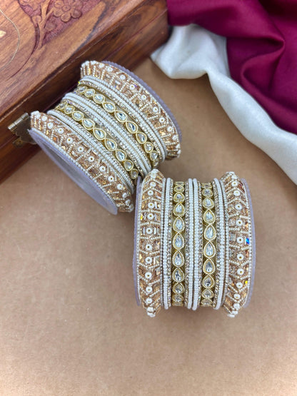Ishhaara Kundan Bangle Set - A pair of intricately designed gold and white bangles with Kundan work