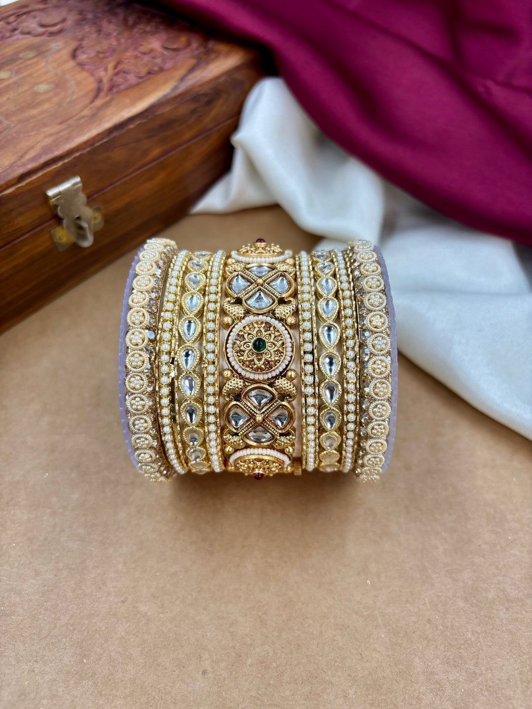Ishhaara Kundan Bangle Set - A close-up view of a beautifully crafted Kundan bangle set with intricate designs and precious stones