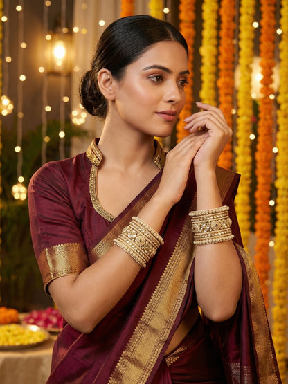 Ishhaara Kundan Bangle Set - A close-up view of a beautifully crafted Kundan bangle set with intricate designs and precious stones - view 2