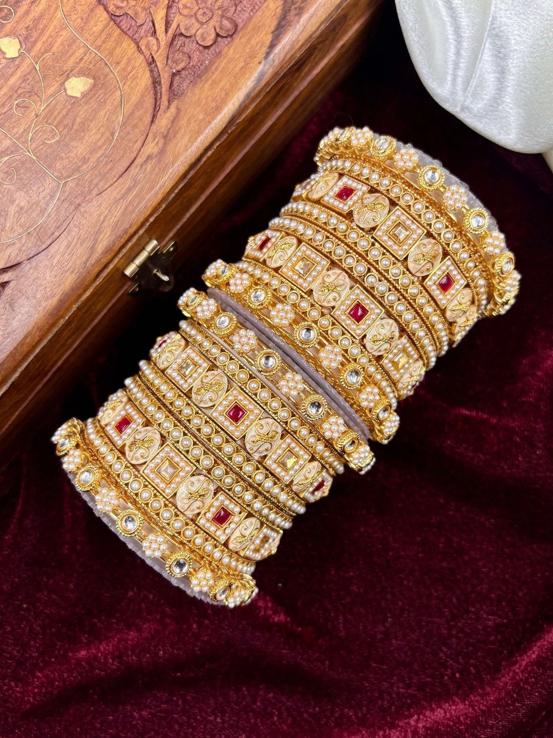 Ishhaara Kundan Bangle Set for Women - a beautiful model wearing gold-plated bangles with intricate designs - view 3