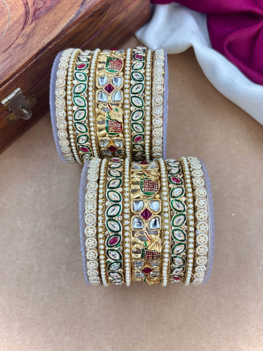 Ishhaara Kundan Bangle Set - A pair of intricately designed gold-plated bangles with kundan work and colorful stones.