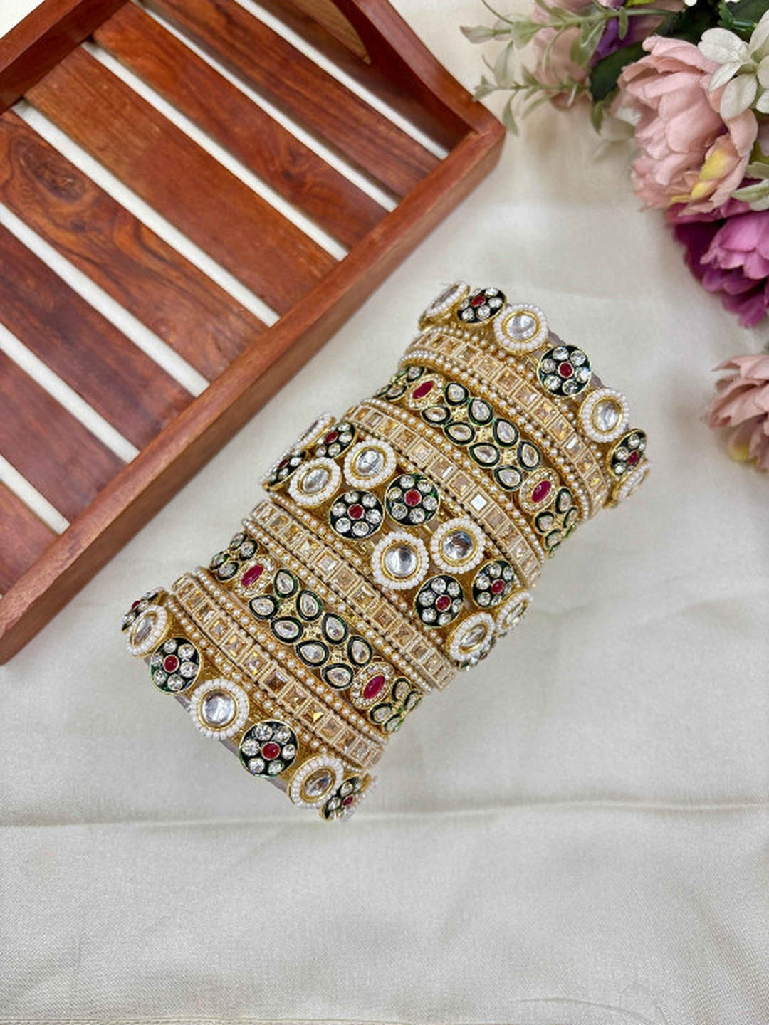 Ishhaara Kundan Bangles Set - a set of intricately designed gold bangles adorned with stones