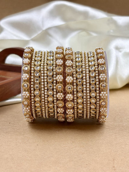 Ishhaara Kundan Bangles Set - a stack of gold bangles with kundan and pearl embellishments - view 2