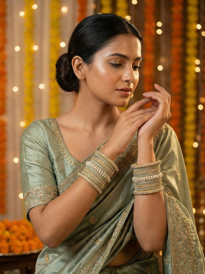 Ishhaara Lavender Embellished Silk Sari - A woman wearing a lavender sari with gold embroidery and traditional Indian jewelry - view 17